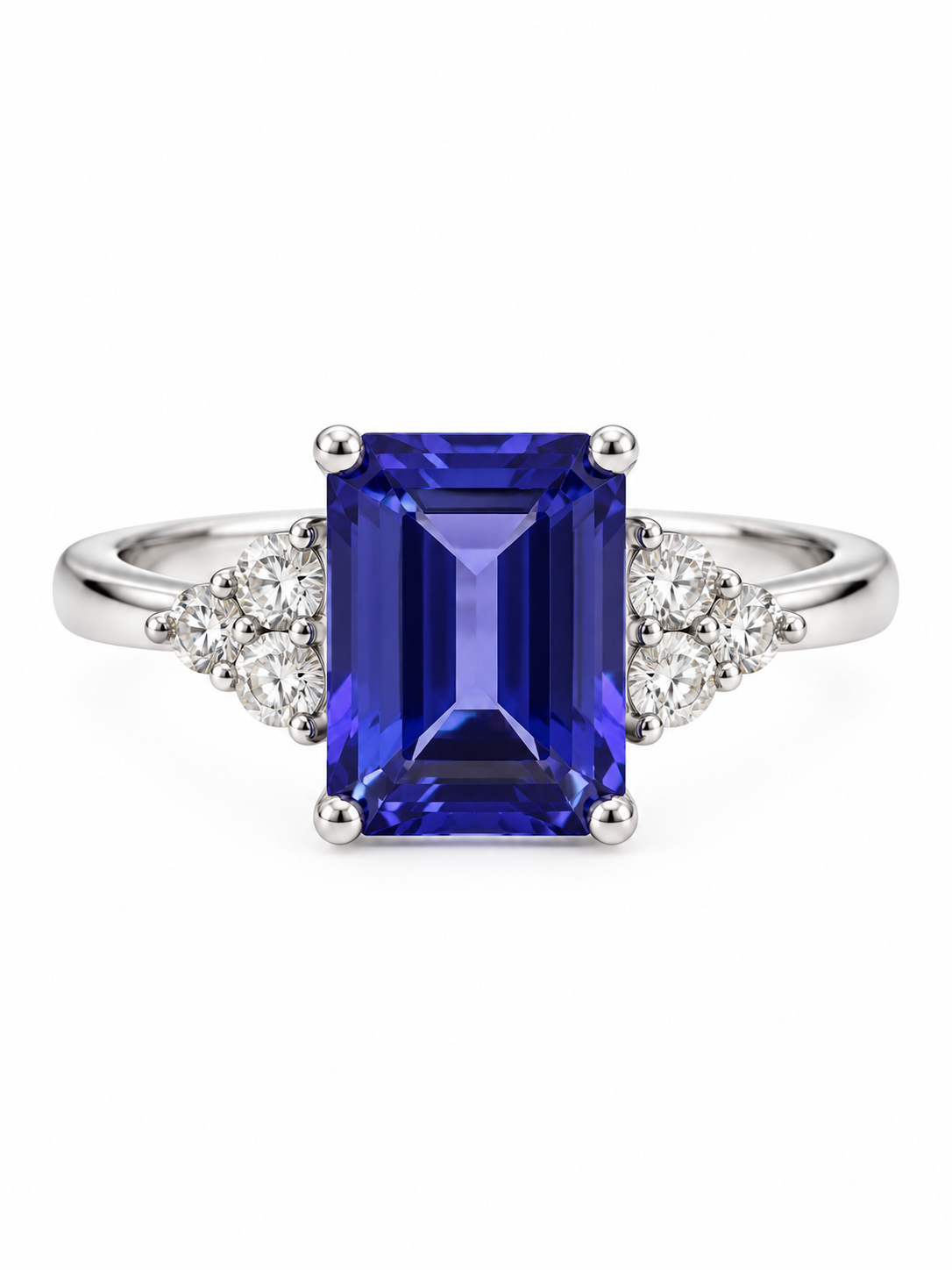 Anillo de oro blanco con tanzanita rectangular azul violeta y diamantes laterales